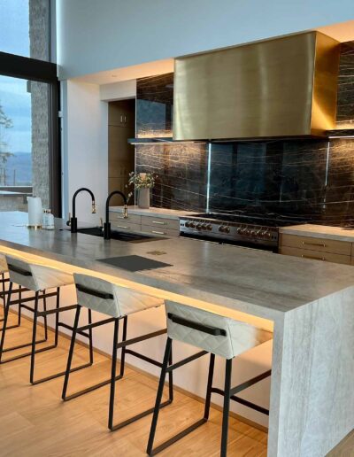 expansive grey marble kitchen island with seating