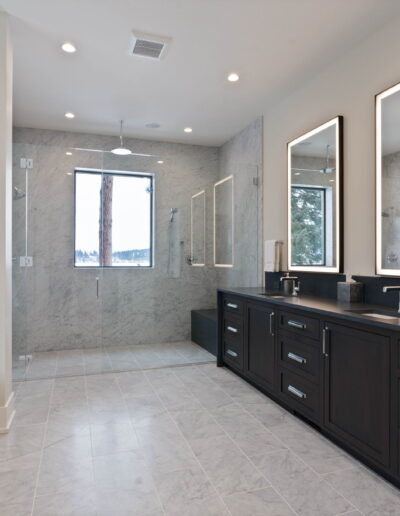 luxury grey marble walk-in shower and black quartz bathroom countertop