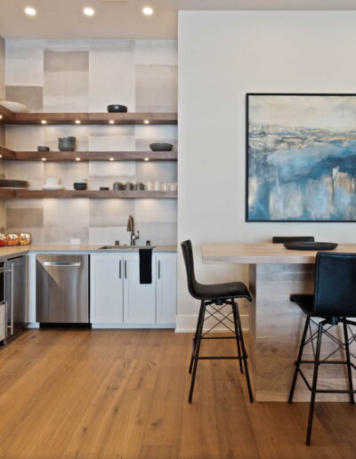 luxury grey tile kitchen with grey quartz countertop and marble top bar