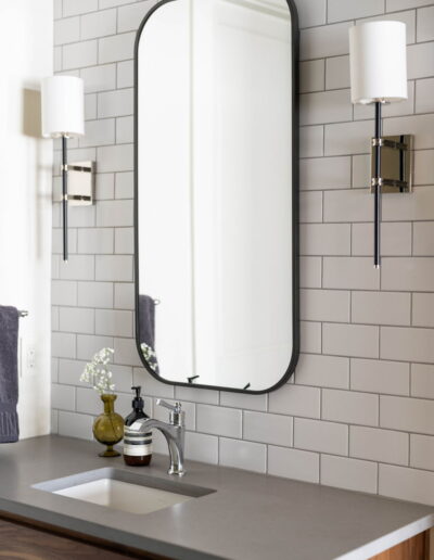 luxury tile bathroom with grey quartz countertops