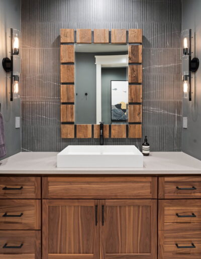 luxury grey tile bathroom with white marble countertops