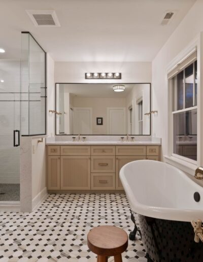 custom luxury white tile walk-in shower and marble bathroom countertops