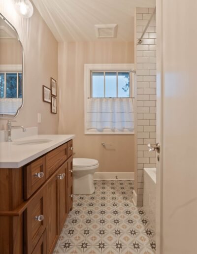 custom luxury white tile shower and marble bathroom countertops