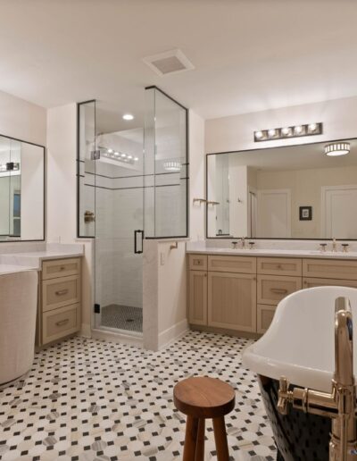 custom luxury white tile walk-in shower and marble bathroom countertops
