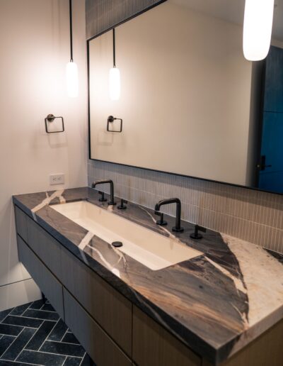 custom modern bathroom double faucets and marble counters