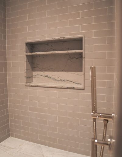 custom grey tile and marble shower with insert
