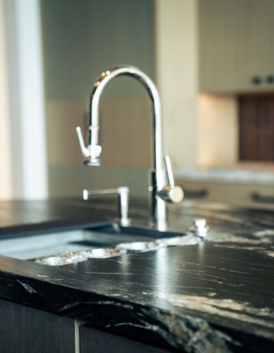 custom modern kitchen sink with black marble counters